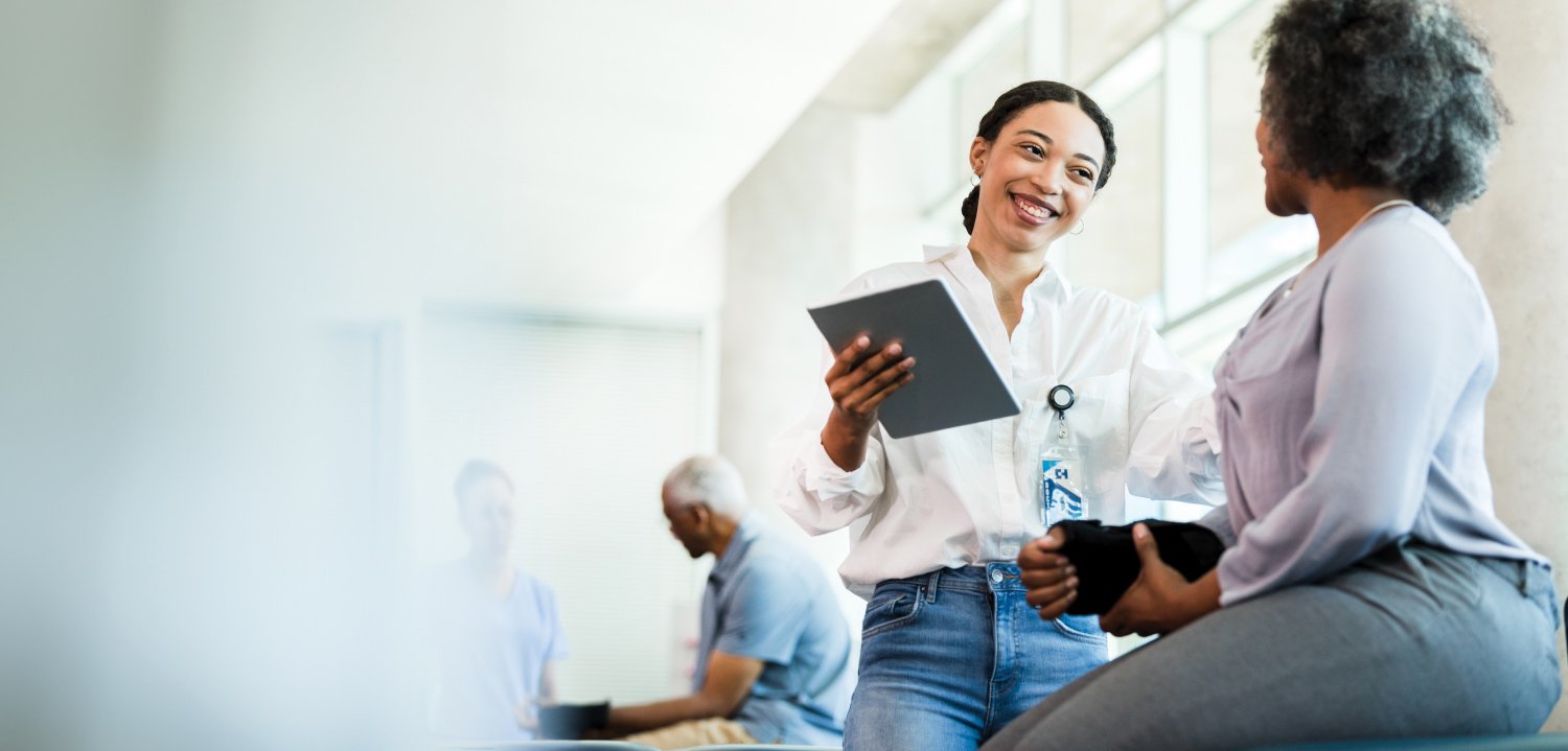 Woman helping another woman at a clinic